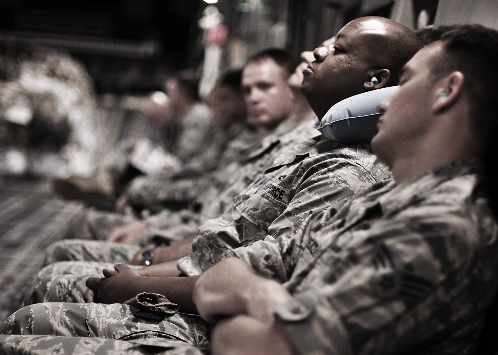 WRIGHT-PATTERSON AIR FORCE BASE, Ohio – Senior Airman took first place in the 2011 Air Force Reserve Command Media Contest’s feature photograph category with this photograph of 445th Logistics Readiness Squadron reservists catching some sleep during their flight aboard a 445th Airlift Wing C-17 Globemaster III bound for Ramstein Air Base, Germany, June 11, 2011. (U.S. Air Force photo/Senior Airman Mikhail Berlin)