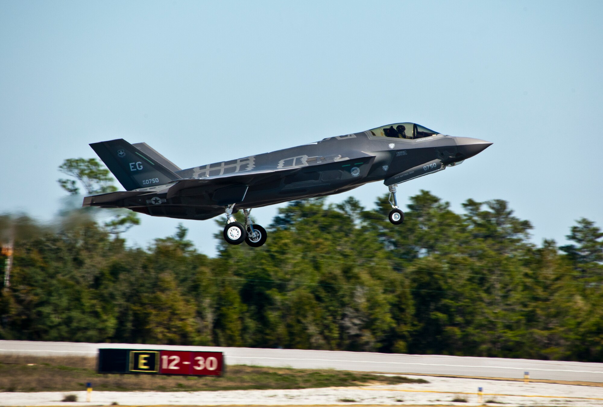 The F-35A Lightning II joint strike fighter lifts off for its first training sortie March 6 at Eglin Air Force Base, Fla.  It’s the first flight of any 33rd Fighter Wing F-35 since their arrival to the base.  (U.S. Air Force photo/Samuel King Jr.)