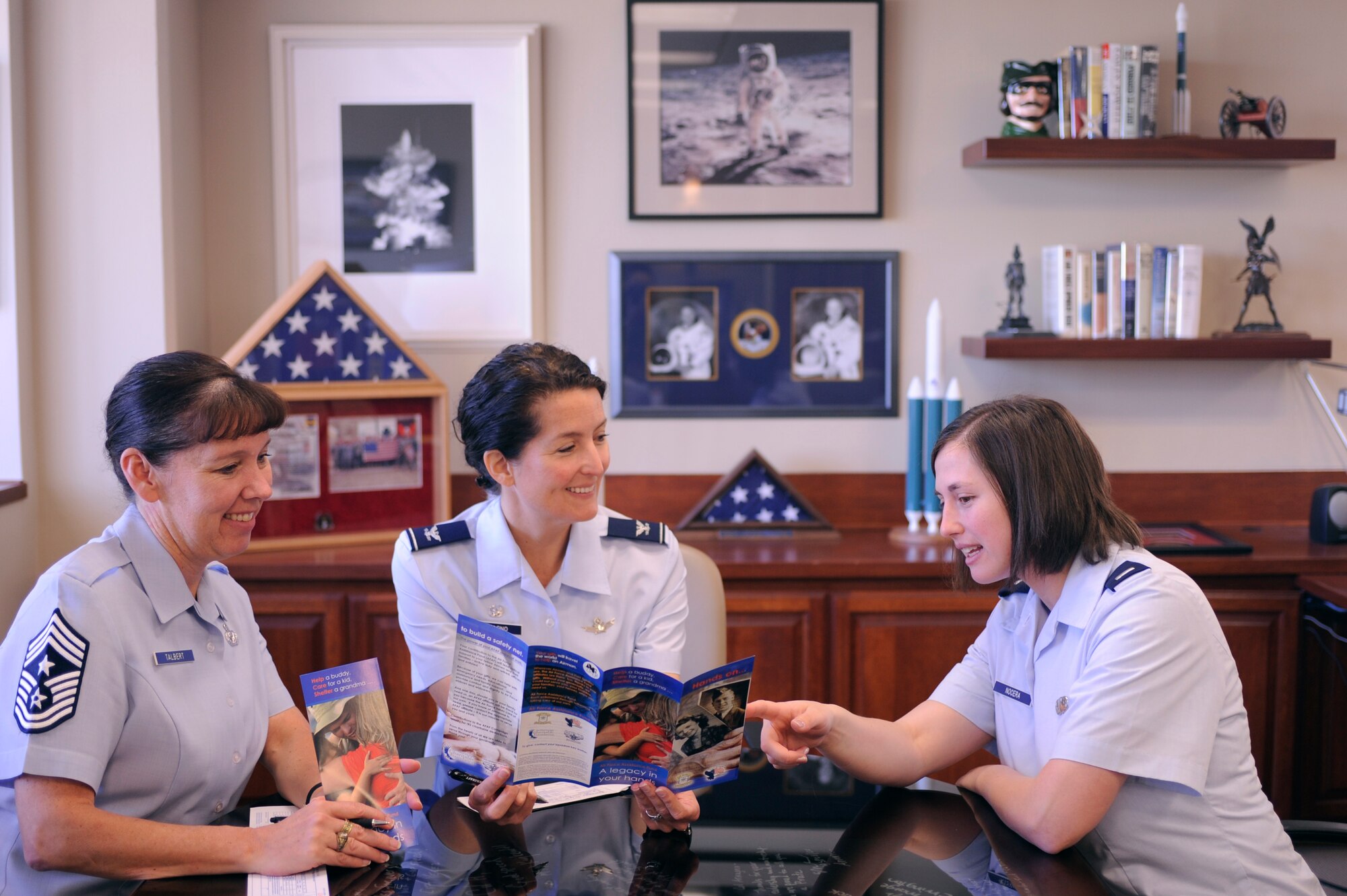 VANDENBERG AIR FORCE BASE, Calif. -- Col. Nina Armagno, 30th Space Wing commander, Chief Master Sgt. Suzanne Talbert, 30th Space Wing command chief, and 1st Lt. Kimberly Nocera, an Air Force Assistance Fund installation project officer, review the AFAF campaign here Monday, March 5, 2012. The AFAF supports Air Force active duty, reservists, guard, retirees, dependents and surviving spouses of the Air Force with emergency aid. (U.S. Air Force photo/Staff Sgt. Andrew Satran) 

  