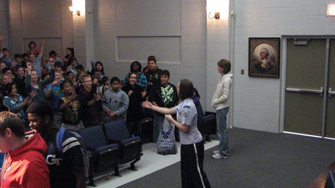 SSgt Melissa Evans speaks with students after a Southwest Winds performance at Goliad High School in Goliad, TX