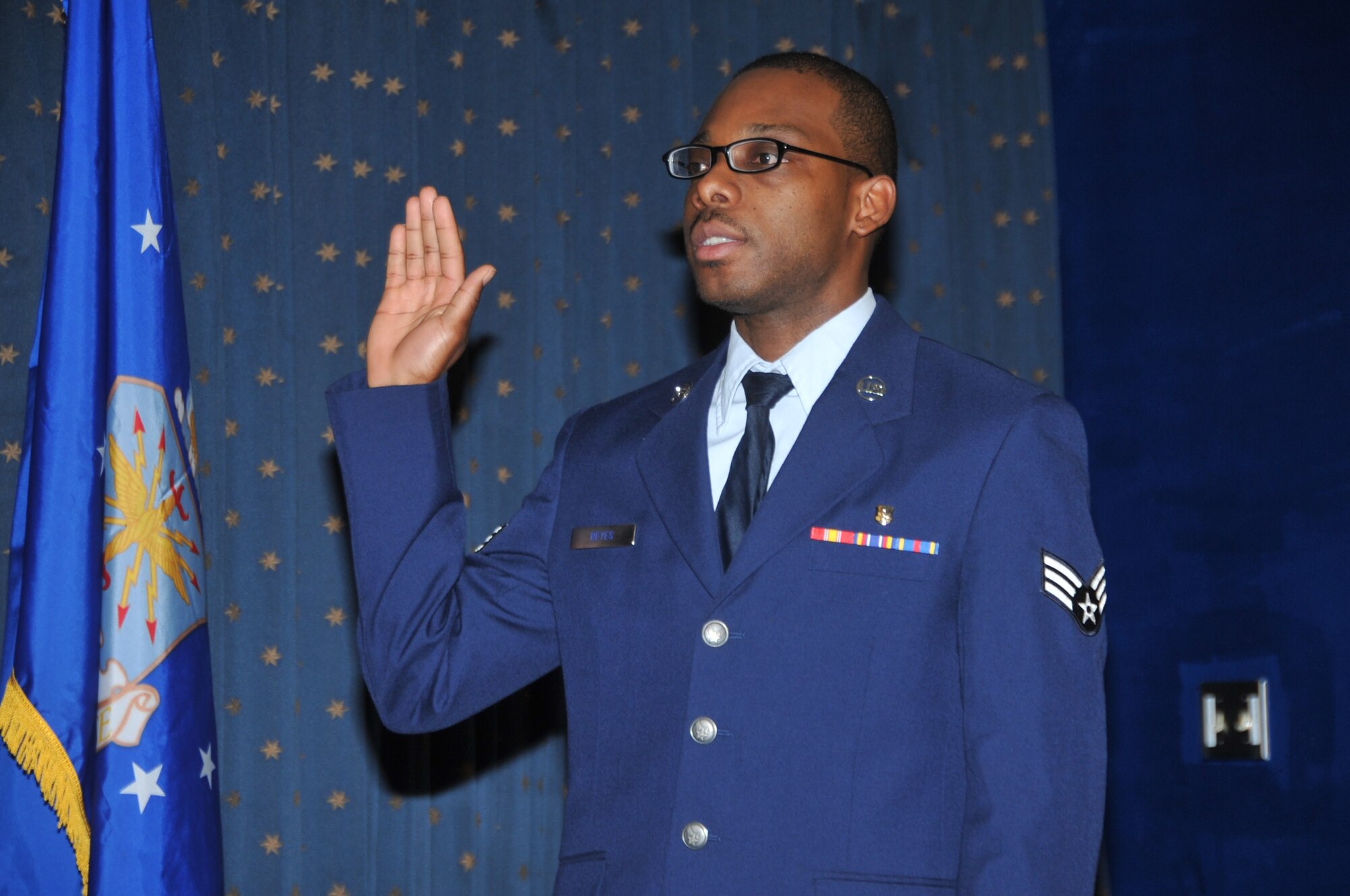 KIRTLAND AFB, N.M. – Senior Airman Raewyn Reyes, 377th Dental Squadron, became a U.S. citizen Feb. 29 during a naturalization ceremony here at the Mountain View Club. Military members with at least one year of service can apply for naturalization under Section 328 of the Immigration and Nationality Act. Reyes, originally from Belize, has been in the Air Force for three years. (Photo by Todd Berenger) 