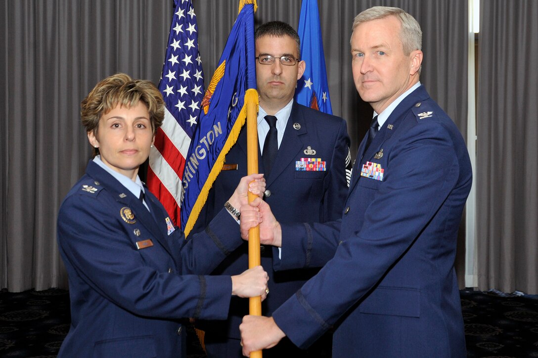 Col. Larry Lang accepts The United States Air Force Band guidon from Col.
Gina Humble, 11th Operations Group commander, during The USAF Band
assumption of command March 6, 2012 at Joint Base Anacostia-Bolling,
Washington, D.C. Lang was the previous U.S. Air Force Academy Band commander
at Peterson Air Force Base, Colo. (U.S. Air Force photo/ Senior Airman Perry Aston)
