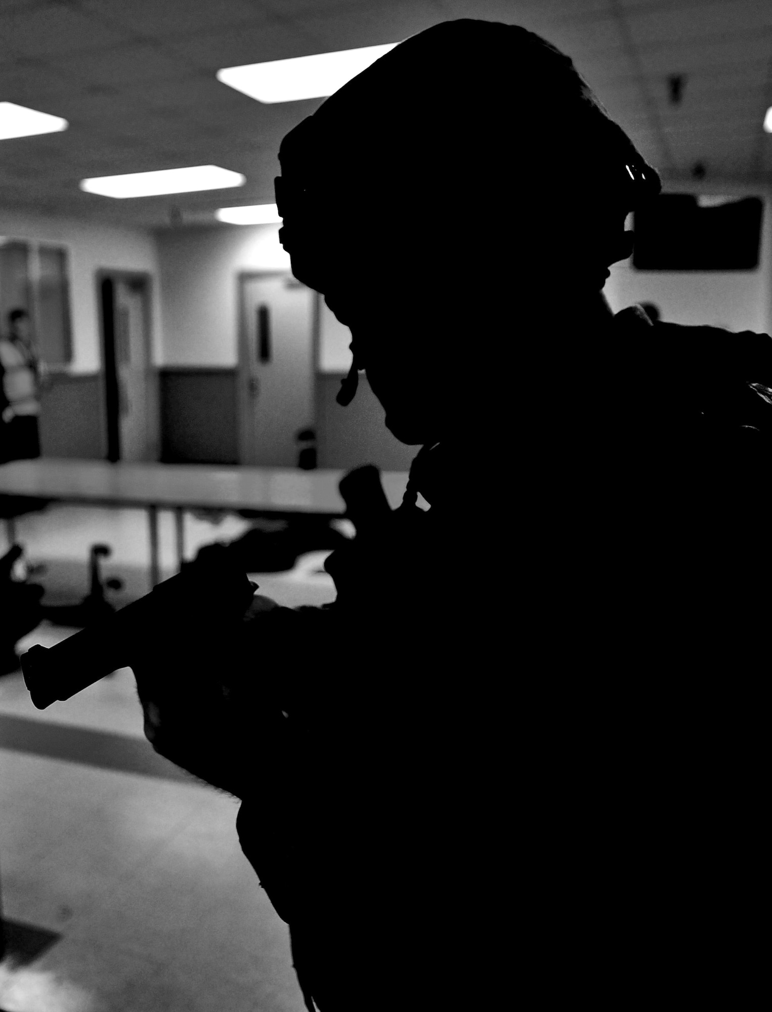 WHITEMAN AIR FORCE BASE, Mo. -- A first responder from the 509th Security Forces Squadron arrives on scene to assist in detaining an active shooter during a Major Accident Response Exercise Feb. 23. The training was designed to instruct security forces members how to quickly find and stop an active shooter. (U.S. Air Force photo/Senior Airman Nick Wilson)