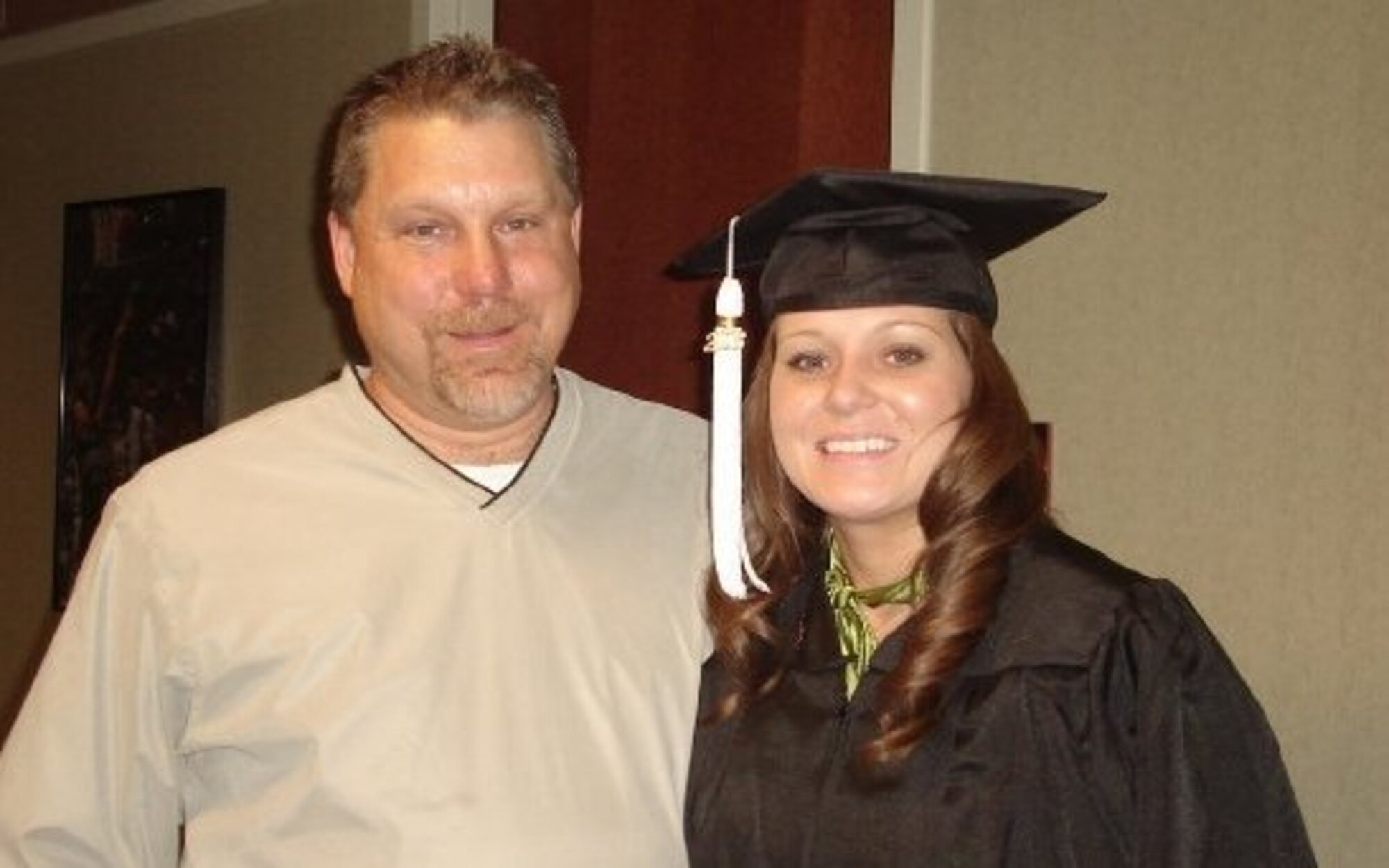 Airman 1st Class Tabitha N. Haynes, Air Force District of Washington Public Affairs, and her dad Rod Haynes, in 2008 when she graduated from The Ohio State University, Columbus, Ohio. 