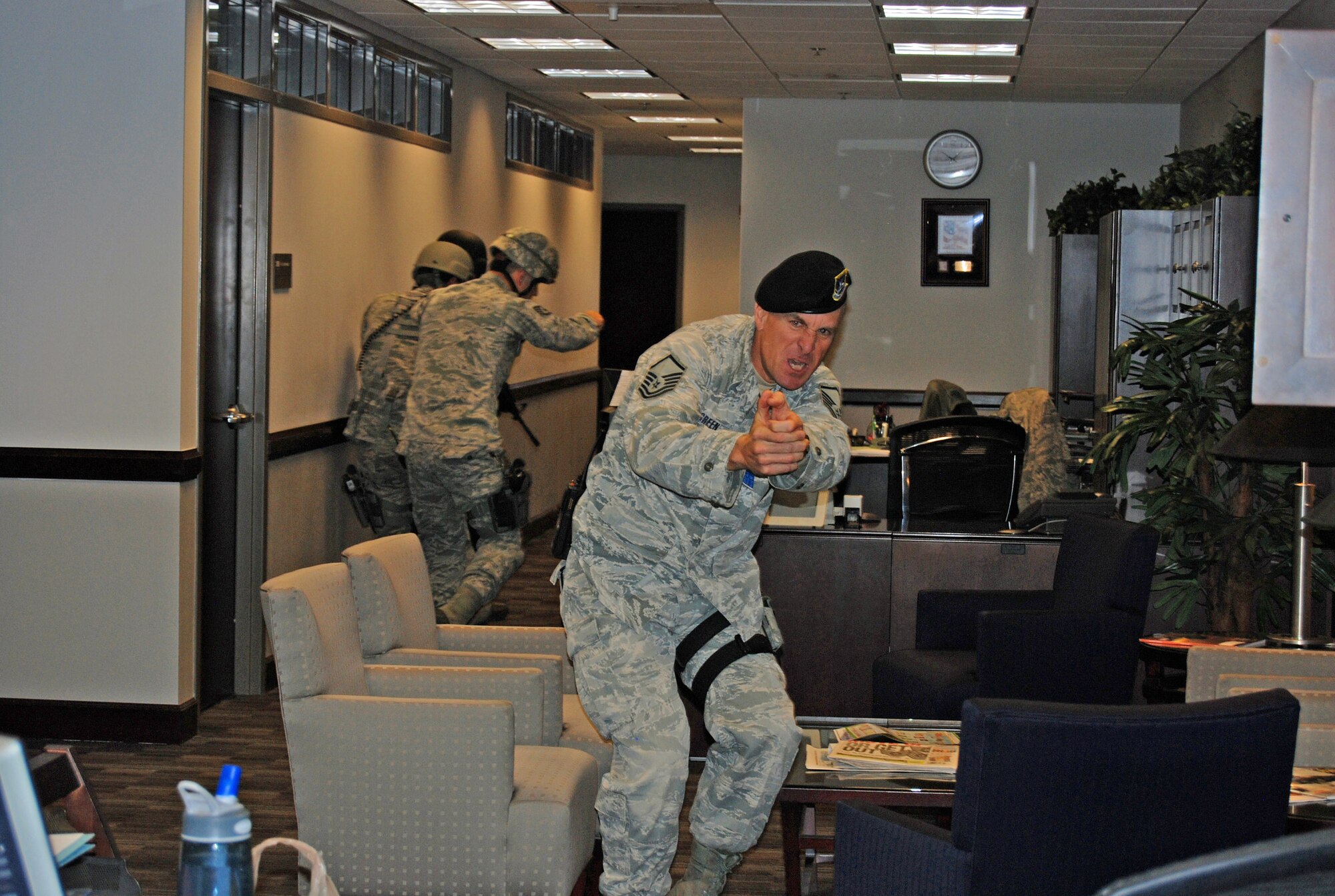 PETERSON AIR FORCE BASE, Colo. — Master Sgt. Frank Green, 21st Security Forces Squadron, clears an office in the 21st Space Wing Headquarters’ building during an active shooter scenario, Feb. 29. The scenario was part of the Condor Crest exercise to ensure readiness in case of real world events. (U.S. Air Force photo/Lea Johnson)