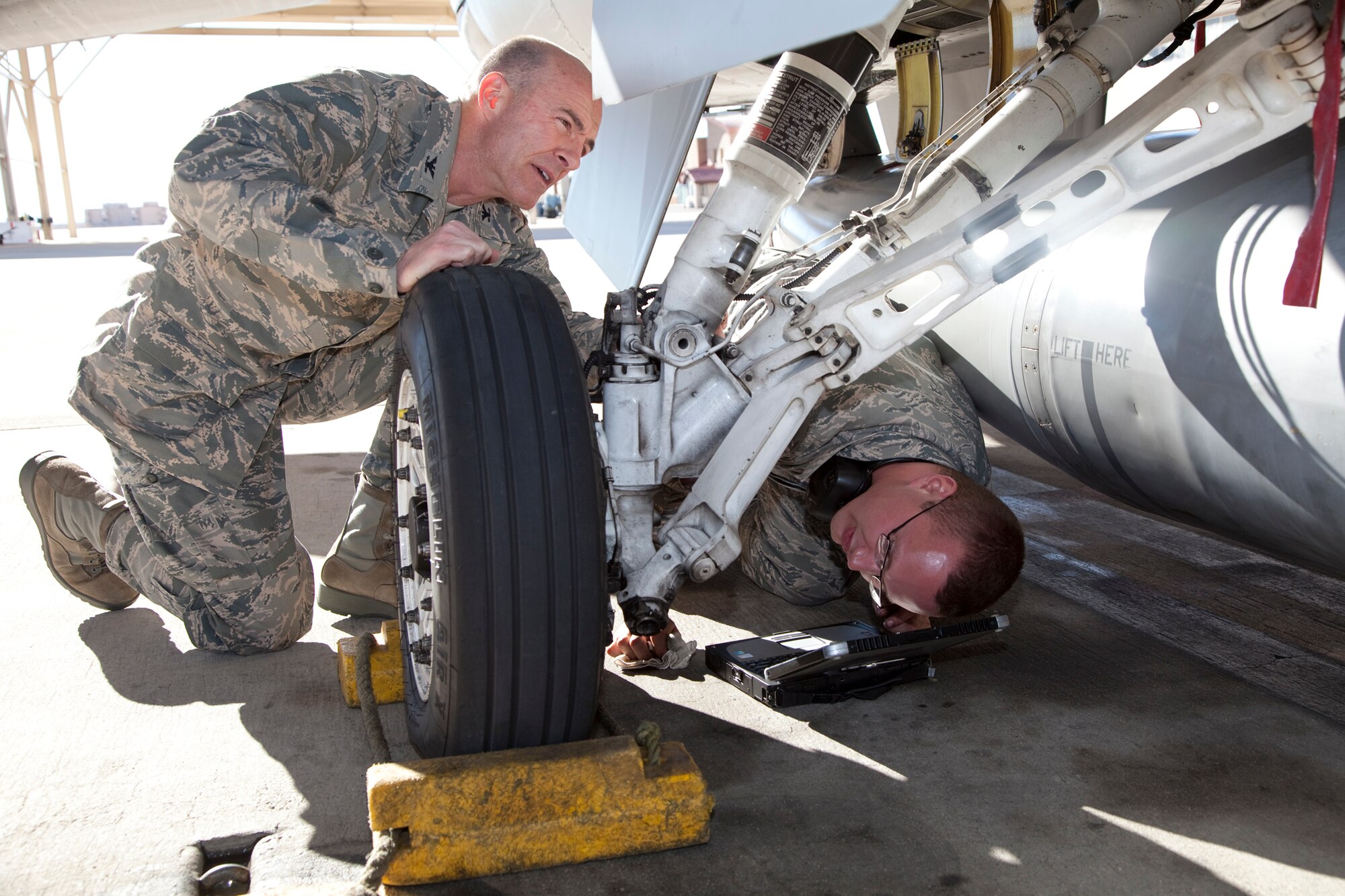 Col. Christopher Azzano (left), 412th Operations Group commander, performs an inspection on an F-16 alongside Airman 1st Class Kyle Deer, 412th Aircraft Maintenance Squadron assistant dedicated crew chief, on Jan. 26, 2012 as part of the 412th Operations and Maintenance Immersion Program. This program is an initiative to give operators and maintainers the opportunity to create positive interaction so both groups gain insight into each other’s work dynamic. (U.S. Air Force photo by Bobbi Zapka)