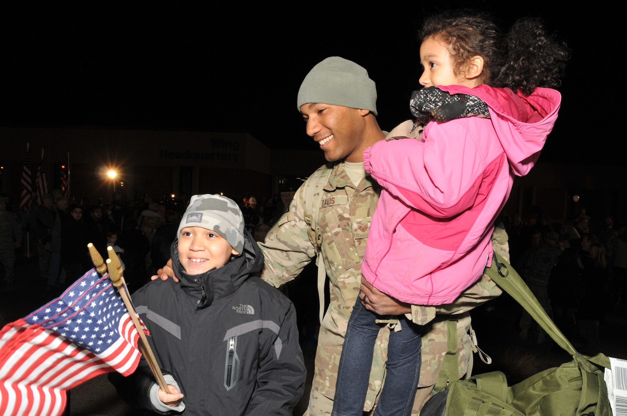 It’s all smiles as Staff Sgt. Kevin Davis is greeted by his children, Sean, 10 and Kloe, 7, upon his return to Bradley Air National Guard Base in East Granby, Conn. from Afghanistan Feb. 20, 2012. Davis is assigned to the 103rd Civil Engineer Squadron and had been deployed since July 2011 with the Expeditionary Prime Base Engineer Emergency Force (BEEF) squadron, performing light construction and facility repair operations including plumbing, interior electric, HVAC, power production and distribution, as well as other engineering tasks.. (U.S. Air Force photos by Tech. Sgt. Erin McNamara\RELEASED)