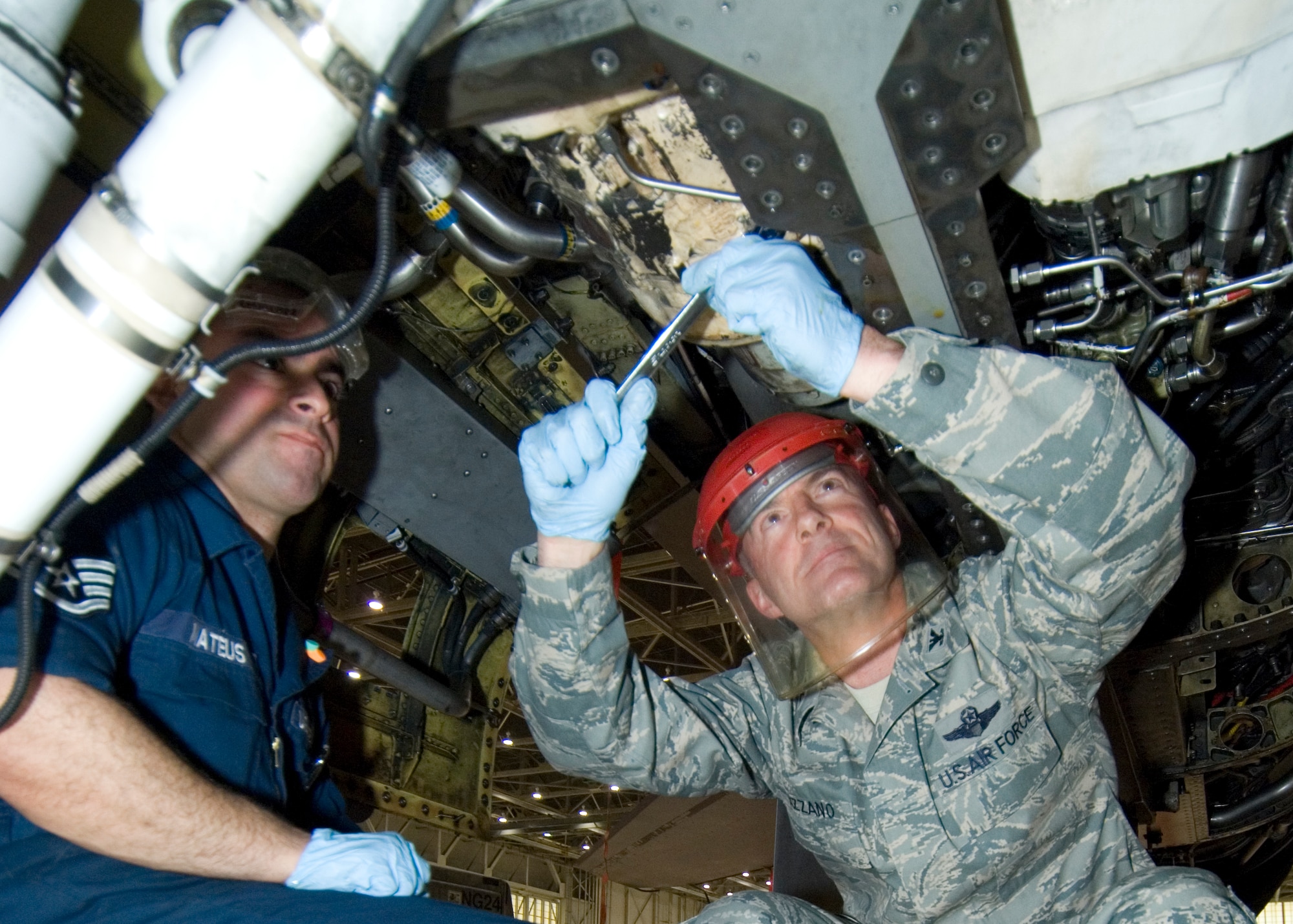 Col. Christopher Azzano, 412th Operations Group commander, works on an F-16 accessory drive gearbox alongside Staff Sgt. Giovanni Mateus, 412th Maintenance Squadron heavy maintenance dock technician, Jan. 26, 2012 as part of the 412th Operations and Maintenance Immersion Program. This program is an initiative to give operators and maintainers the opportunity to create positive interaction so both groups gain insight into each other’s work dynamic. (U.S. Air Force photo by Edward Cannon)