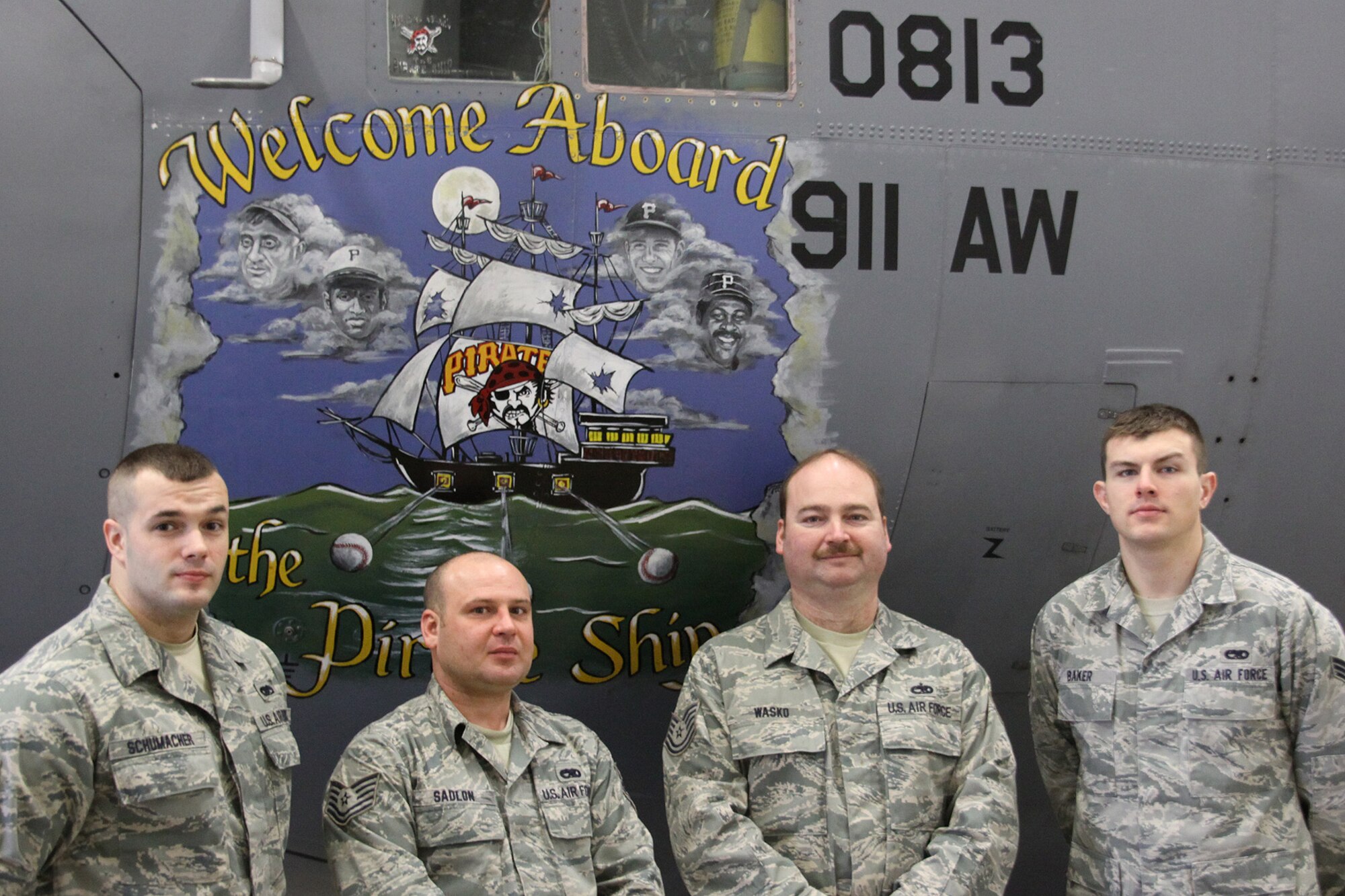 PITTSBURGH IAP ARS-  The 911th Aircraft Maintenance Squadron crew chiefs assigned to Aircraft 813, (from left to right) Senior Airman Aaron Shumacher, Tech. Sgt. Robert Sadlon, Tech. Sgt. Jay Wasko, and Senior Airman Matthew Baker, stand by their plane, Jan. 7, 2012. The crew’s C-130 is the current “Top Flyer” at the 911th Airlift Wing with over 16,000 flying hours. (U.S. Air Force Photo by Senior Airman Jonathan Hehnly\Released)