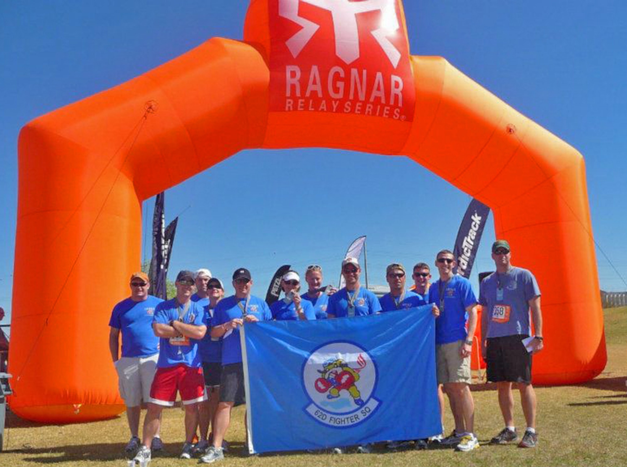 Twelve Thunderbolts ran the 200-mile Ragnar Del Sol relay Feb. 24 through Saturday.  FROM LEFT: Maj. Matt Acer, Capt. Tom Tauer and Lt. Col. Paul Willingham, 62nd Fighter Squadron; Ann Lincoln, 310th FS; Lt. Col. Brian Jackson, Emily Jackson, Winnie Kjelsgaard, Capt. Matt Olson, Maj. Frank Bricel, Maj. Chris Moeller and Capt. Mark Warner, 62nd FS; and Maj. Scooter White, 310th FS.  (Courtesy photo)