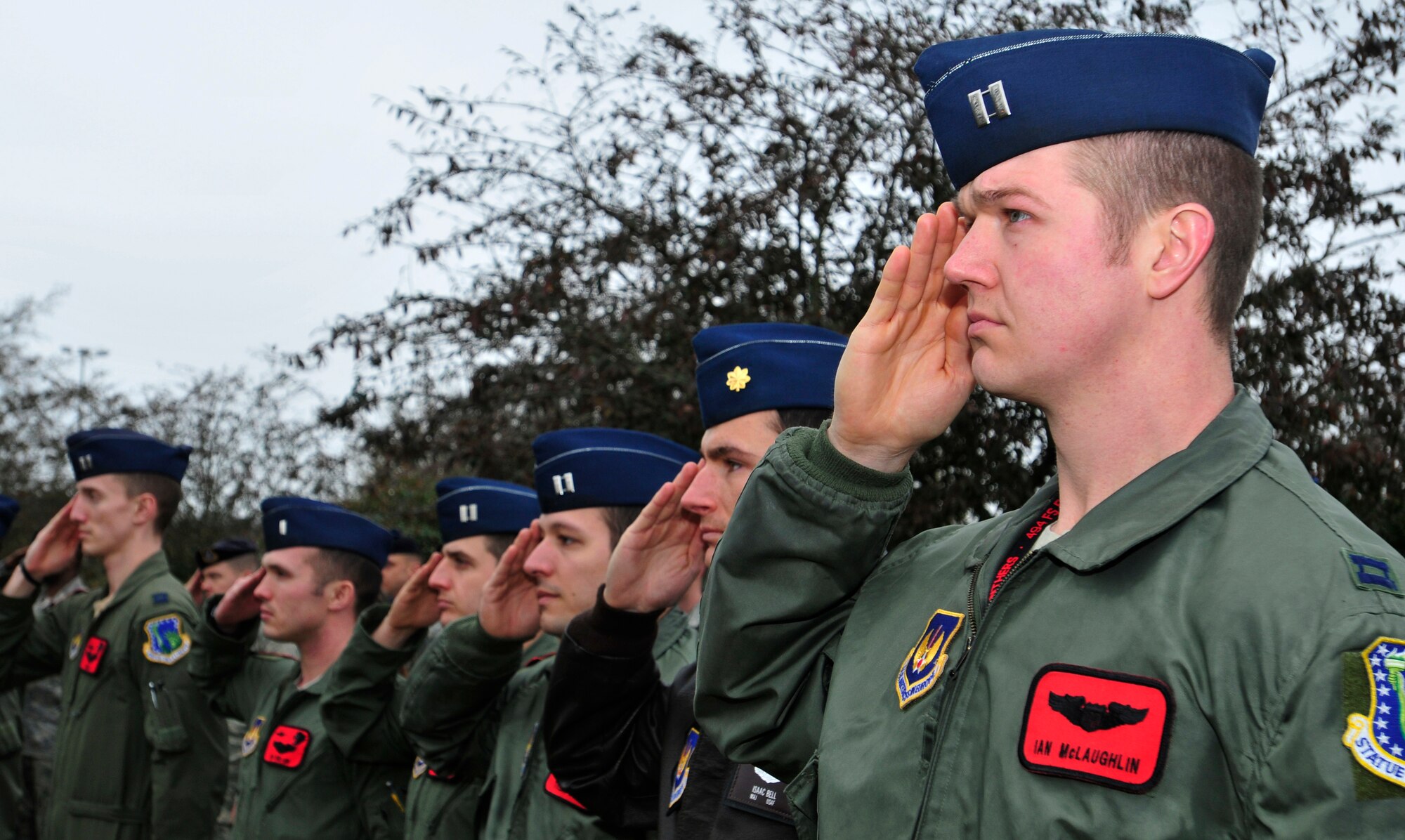 ROYAL AIR FORCE LAKENHEATH, England – Airmen render salutes as the British and American national anthems are played during the dedication of the Liberty’s Fallen Defenders Memorial March 2, 2012. The ceremony was held on the one year anniversary of the shooting at Frankfurt International Airport, Germany. A stone monument honoring the memory of 48th Security Forces Squadron Senior Airmen Jason D. Nathan and Nicholas J. Alden was unveiled before more than 250 Airmen and civilians. Nathan was killed in action while deployed to Iraq in June 2007. Alden was killed during the Frankfurt shooting while preparing to deploy to Afghanistan in March 2011. The monument will also serve as a reminder of all Liberty Defenders who have fallen since 2001. (U.S. Air Force photo by Senior Airman Tiffany M. Deuel)