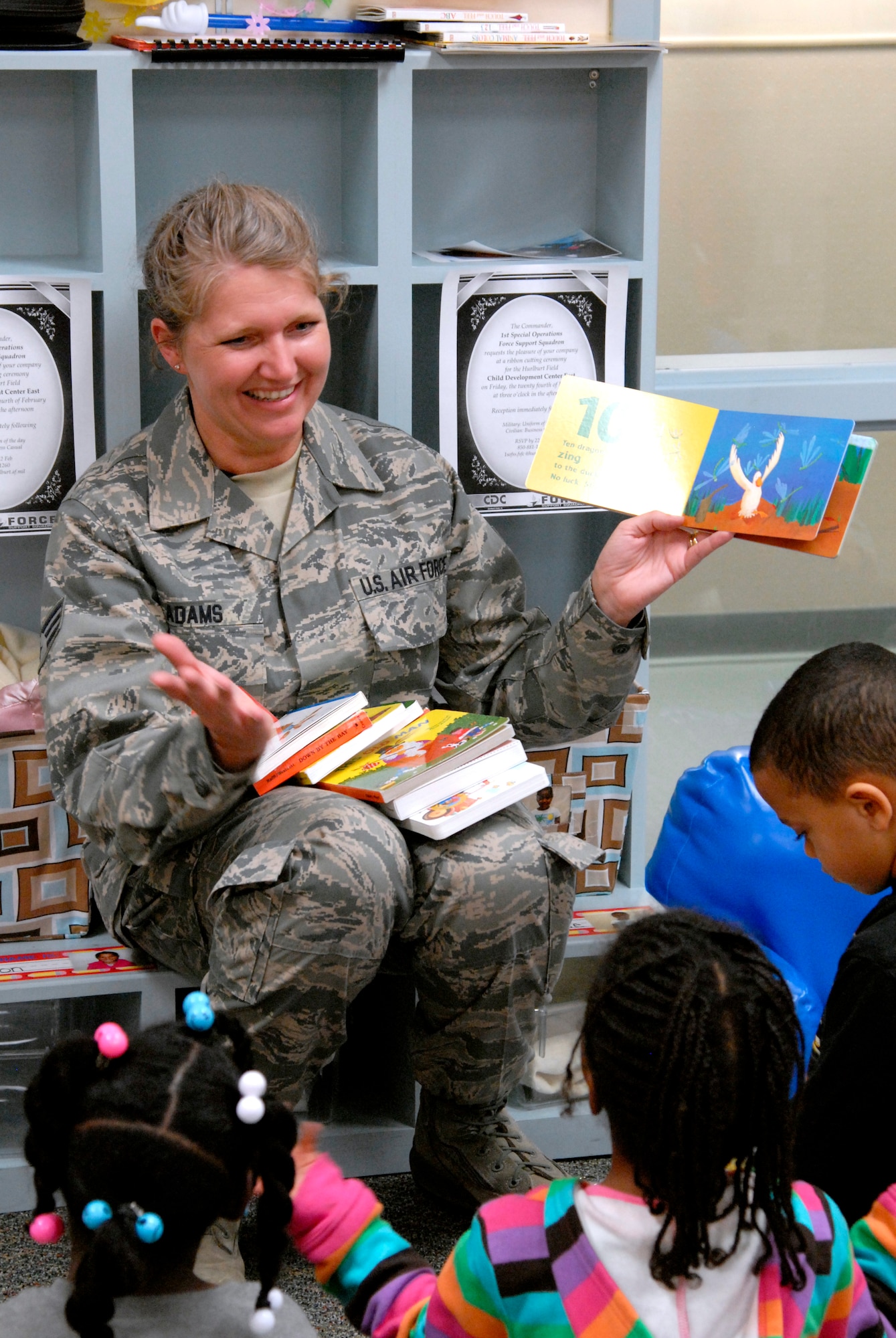 Senior Airman Nancy Adams, an education and training technician with the 556th RED HORSE, reads to children while visiting a classroom at the Child Development Center East at Hurlburt Field, Fla., Feb. 22, 2012. Adams is both a reservist with RED HORSE and director of Hurlburt’s two CDCs. (U.S. Air Force photo/Airman 1st Class Michelle Vickers)(Released)
