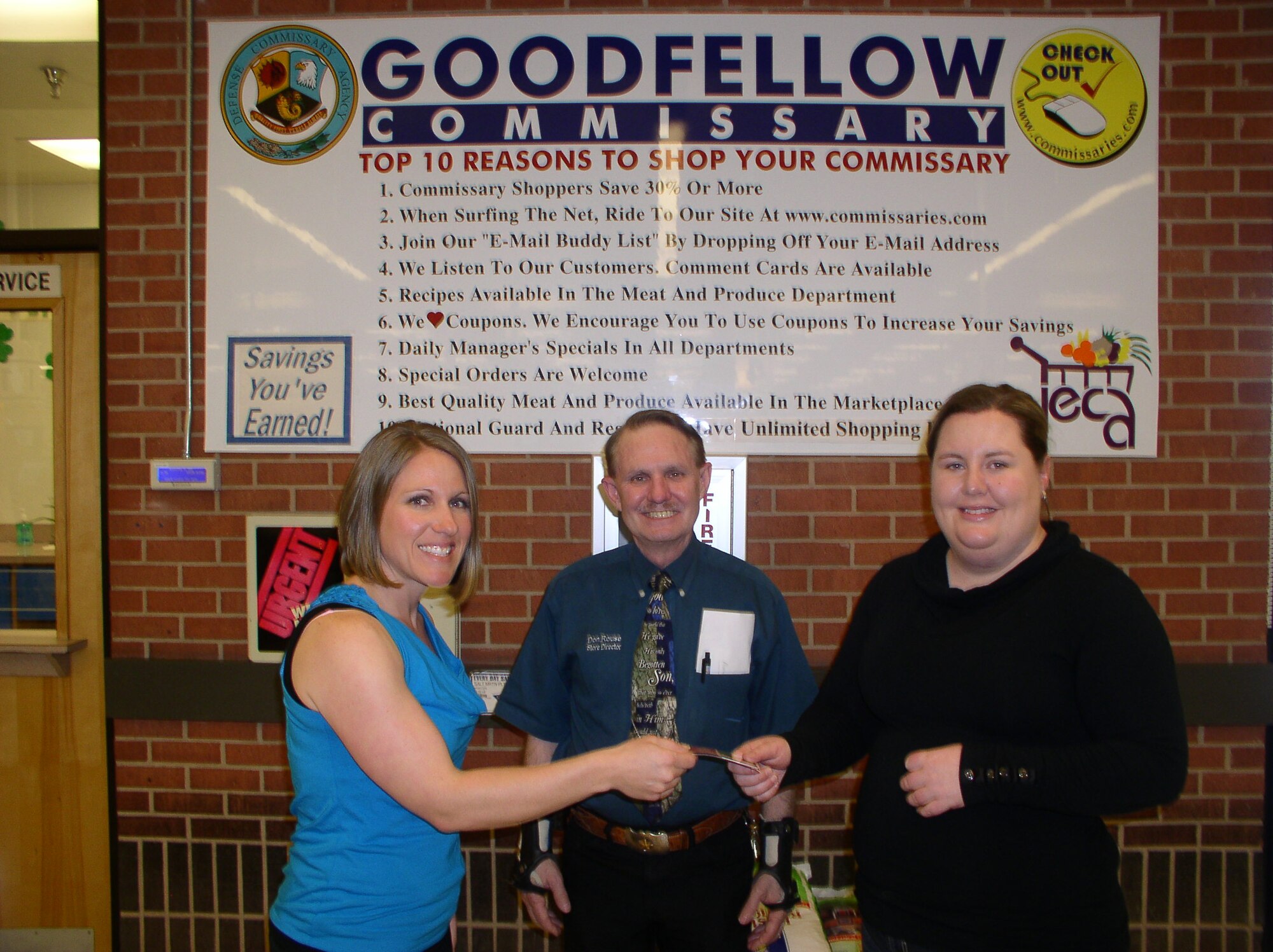 GOODFELLOW AIR FORCE BASE, Texas--  Rachel Preen, 17th Training Wing spouse, receives a certificate from Kassie Smith, a representative of Financial Industry Regulatory Authority and National Military Family Association. Preen won second place in the Military Saves Campaign’s Coupon Savers Contest for using store coupons to cut $231.04from her grocery bill. The first place winner, Olivia Campos, 17th Training Wing spouse, saved $551.86  and was unavailable for a photo.(courtesy photo)

