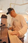 Minton Newman, 902nd Force Support Squadron customer at Joint Base San Antonio-Randolph arts and crafts wood working hobby shop, sands a board for his wood working project Feb. 28. (U.S. Air Force Photo by Don Lindsey)