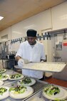 Joseph Patterson, 902nd Force Support Squadron cook, prepares a salad for a luncheon at the Kendrick Club -Joint Base San Antonio-Randolph Feb. 28. (U.S. Air force Photo by Don Lindsey)