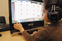 Nathan Gonzales makes a selection on the new Hatch computer at the 902nd Force Support Squadron Child Development Center- Joint Base San Antonio-Randolph Feb. 28. (U.S. Air Force Photo by Don Lindsey)