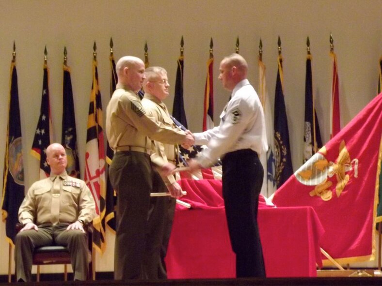 U.S. Air Force Master Sgt. Matthew Stathakis receives a certificate of completion during a Senior NCO Academy graduation at Camp Lejeune, N.C., Feb. 24, 2012. Prior to pinning on senior master sergeant stripes, Airmen must complete a formal professional military education course, which usually is done at Maxwell-Gunter Air Force Base, Ala. Stathakis, 4th Medical Group first sergeant, hails from Deerfield Beach, Fla. (Courtesy photo)