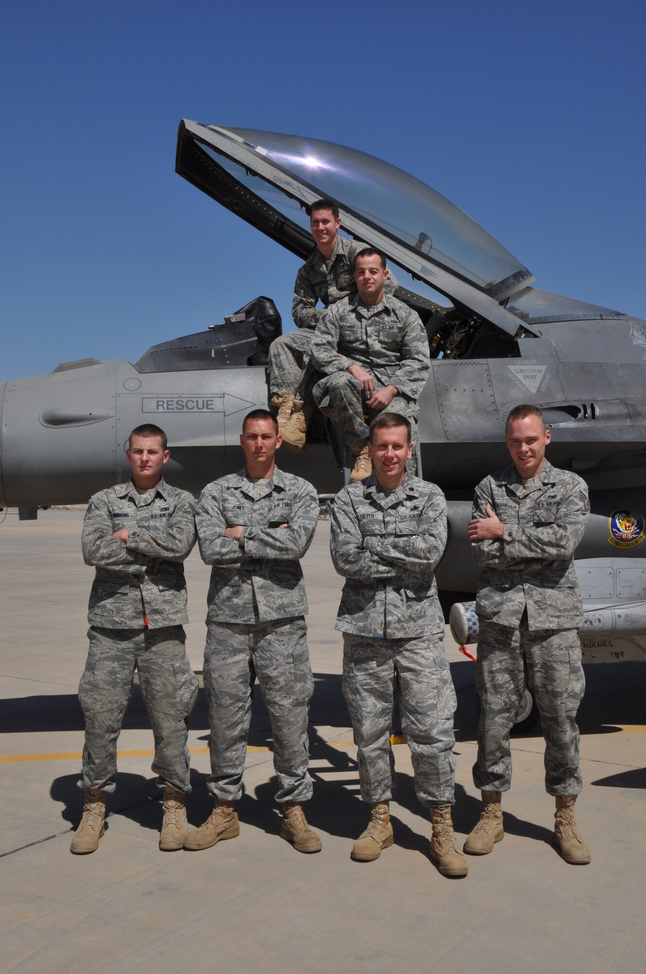SOUTHWEST ASIA -- Senior Airmen Joshua Mahkovitz and Roscerio Accardi (top), Senior Airman Kaleb Simmons, Airman 1st Class Matthew Jones, Lt. Col. Chad Heyen, and Staff Sgt. John Ackerman (bottom),  pose for a photo March 6, 2012 at an undisclosed location in Southwest Asia. These six members of the 332nd Expeditionary Aircraft Maintenance Squadron are from small towns in south-central Illinois. Heyen is deployed from Hill Air Force Base, Utah, and the others are deployed from Shaw Air Force Base, S.C. (U.S. Air Force photo by Senior Airman Melanie Holochwost/Released)