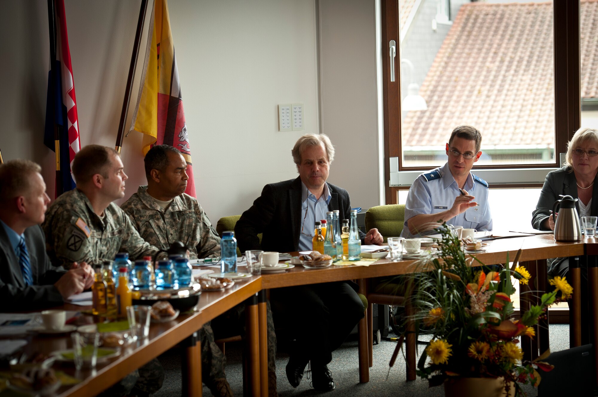 U.S. Air Force Brig. Gen. C.K. Hyde, 86th Airlift Wing commander, discusses construction plans within the Kaiserslautern Military Community with U.S. Army Brig. Gen. Aundre F. Piggee, 21st Theater Sustainment Command commander, and a group of local mayors, assembled at the Bruchmuehlbach-Miesau Rathaus, Feb. 29, 2012. The Mayors’ Forum is held twice a year in different towns of the region providing U.S. military and host nation officials the opportunity to exchange information, and an opportunity for local mayors to raise issues directly with top KMC military leadership in an informal setting. (U.S. Air Force photo by Senior Airman Stephen J. Otero)