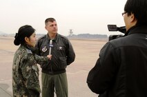 A military broadcaster from the Korean Forces Network interviews Col. Craig Leavitt, 8th Operations Group commander, March 2, 2012, during a combined combat generation exercise on Kunsan Air Base, Republic of Korea. The exercise tested Airmen’s ability to fully generate aircraft for wartime operations. (U.S. Air Force photo by Senior Airman Jessica Hines/Released)