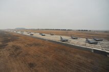A formation of F-16 Fighting Falcons progresses down the flight line at Kunsan Air Base, Republic of Korea, March 2, 2012, in a show of power called an “Elephant Walk.” The exercise showcased Kunsan AB aircrews' capability to quickly and safely prepare an aircraft for a wartime mission. (U.S. Air Force photo by Senior Airman Brittany Y. Auld/Released)