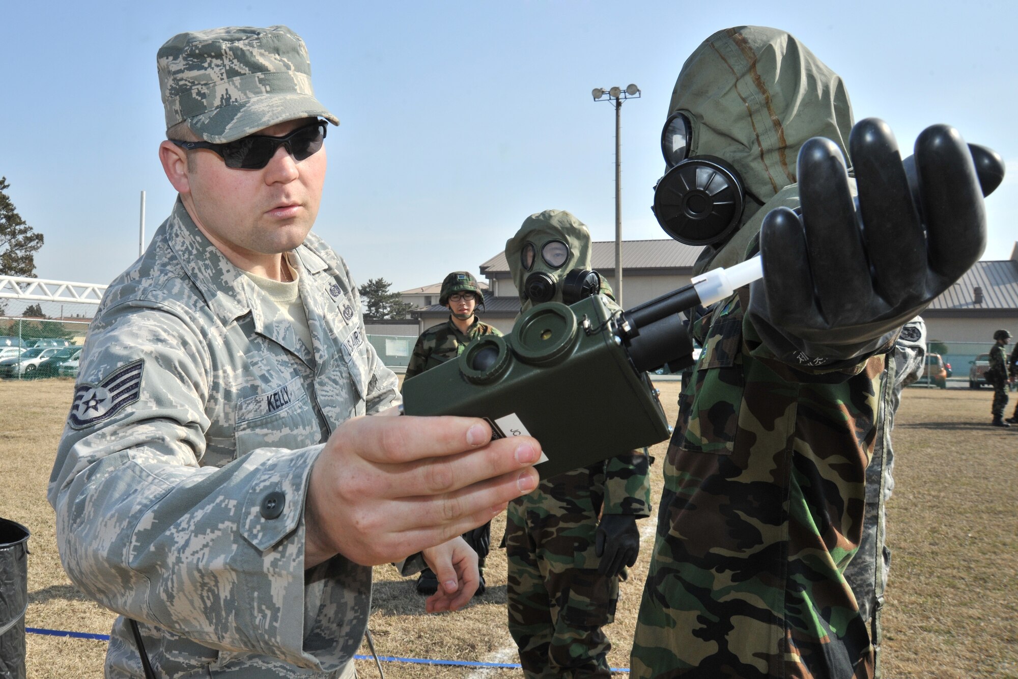 Staff Sgt. Robert Kelly, 8th Civil Engineer Squadron NCO in charge of training demonstrates how to a Joint Chemical Agent Detector during counter chemical, biological, radiological, nuclear and explosive training at Kunsan Air Base, Republic of Korea, Feb. 29, 2012. The training involved joint post attack chemical, biological and radiological reconnaissance operations to determine the extent of CBRN hazards to the installation. (U.S. Air Force photo by Senior Airman Brittany Y. Auld/Released)