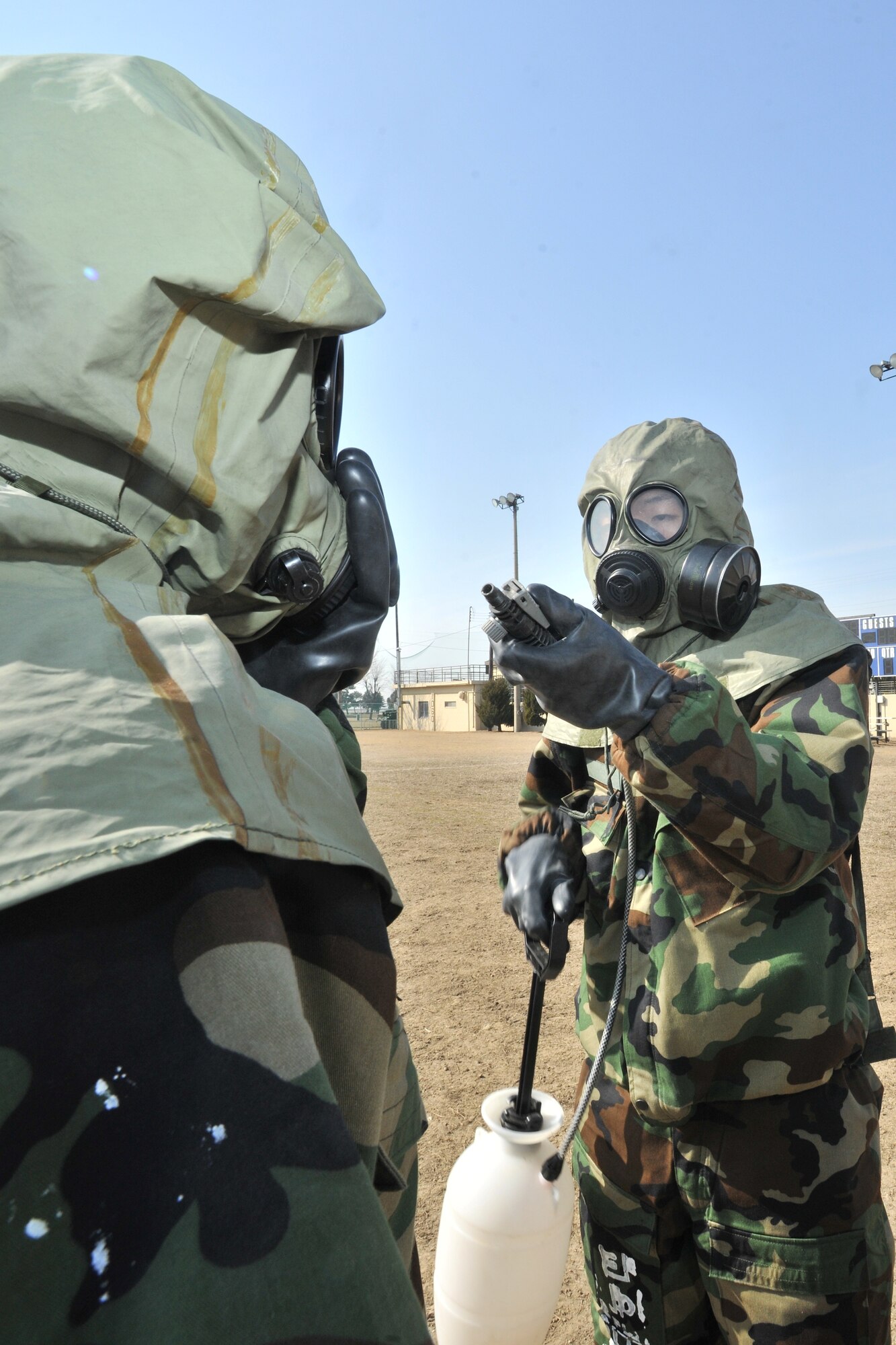 Republic of Korea Air Force and Army personnel participate in counter chemical, biological, radiological, nuclear and explosive training led by the 8th Civil Engineer Squadron readiness and emergency management flight at Kunsan Air Base, ROK, Feb. 29, 2012. Joint training with ROK Forces happens twice a year.  (U.S. Air Force photo by Senior Airman Brittany Y. Auld/Released)
