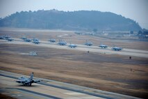 A formation of F-16 Fighting Falcons progresses down the flight line at Kunsan Air Base, Republic of Korea, March 2, 2012, in a show of power called an “Elephant Walk.” The highly-maneuverable F-16s can reach a speed of 1,500 mph and are used for air-to-air combat and air-to-surface attack missions. (U.S. Air Force photo by Senior Airman Brigitte N. Brantley/Released)