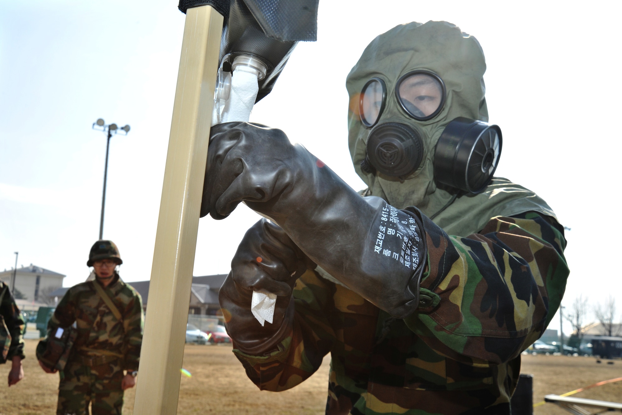 Republic of Korea Air Force and Army personnel participate in counter chemical, biological, radiological, nuclear and explosive training led by 8th Civil Engineer Squadron readiness flight and emergency management Airmen at Kunsan Air Base, ROK, Feb. 29, 2012. The training involved joint post attack chemical, biological and radiological reconnaissance operations to determine the extent of CBRN hazards to the installation. (U.S. Air Force photo by Senior Airman Brittany Y. Auld/Released)