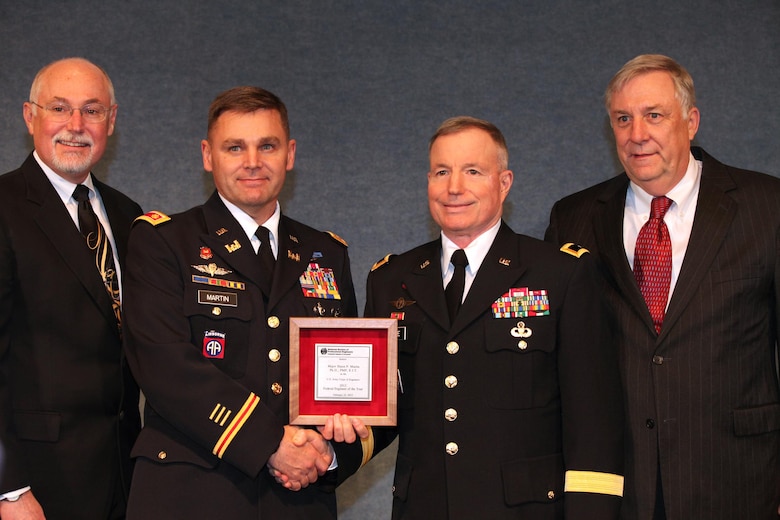 WASHINGTON, D.C. — Oregon Army National Guard Soldier Maj. Shaun P. Martin (center left), accepts the U.S. Army Corps of Engineers Federal Engineer of the Year (Military) Award here, Feb. 24, 2012. Martin won the award while on assignment in California with the U.S. Army Corps of Engineers San Francisco District.
