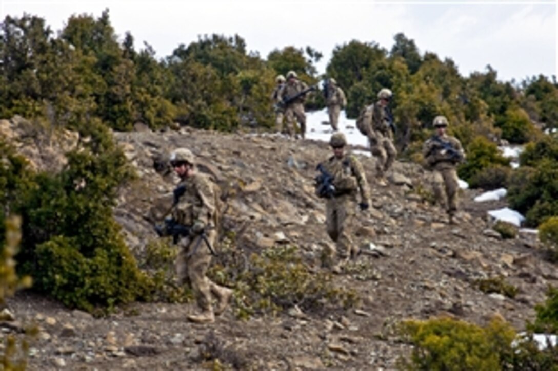 U.S. Army soldiers descend a mountaintop in the Paktya province while surveying a site for an observation post near the Enzarkay Pass, Afghanistan, March 2, 2012. The soldiers are paratroopers assigned to Company A, 3rd Battalion (Airborne), 509th Infantry Regiment, Task Force Gold Geronimo.