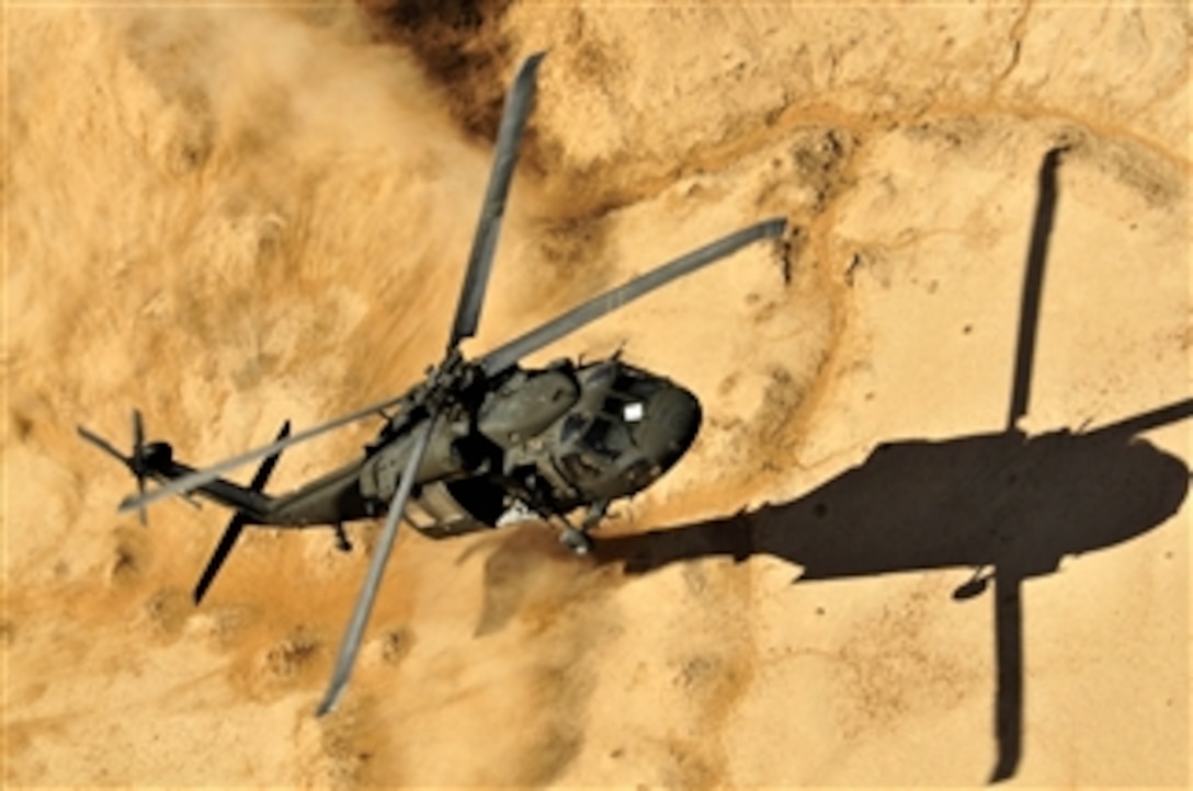 Members of a UH-60 Black Hawk helicopter, assigned to Alpha Company, 2nd Battalion, 25th Aviation Regiment, 25th Combat Aviation Brigade, come in for a dust landing with soldiers from 1st Battalion, 25th Stryker Brigade Combat Team during an air assault training mission led by the Kandahar Air Wing and Afghan National Army in Kandahar province, Afghanistan, on Feb. 29, 2012.  