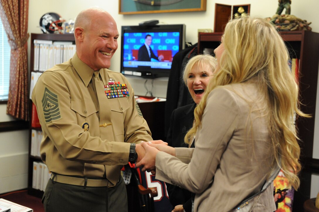 Sgt. Maj. Micheal P. Barrett, the 17th Sergeant Major of the Marine Corps, visits with Erika Frantzve, Miss Arizona USA 2012, and Alexa Zellars, Miss Arizona Teen USA 2012, in the Pentagon, Washington, D.C., March 6, 2012.