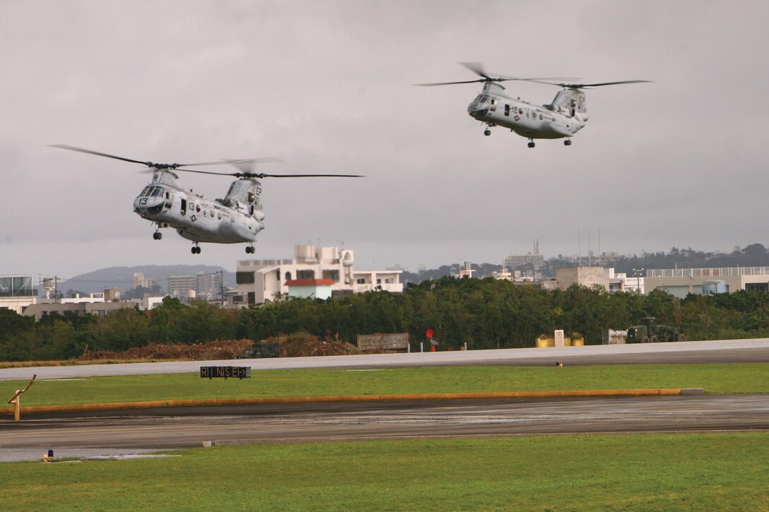 CH-46E Sea Knight helicopters with Marine Medium Helicopter Squadron 265 land on the flight line on Marine Corps Air Station Futenma Feb. 15. The helicopters returned from the central training area where they provided airlift capability to Marines with Battalion Landing Team 1st Battalion, 4th Marine Regiment. HMM-265 is currently assigned to the 31st Marine Expeditionary Unit.