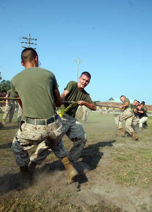 Marines in Headquarters Battalion, 2nd Marine Division, tug-of-war during the Headquarters Battalion field meet aboard Marine Corps Base Camp Lejeune, N.C., July 29, 2011. The field meet was the closing to a year-long competition between the companies within the battalion.