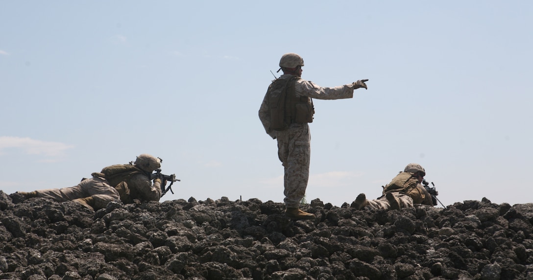 Marines with 2nd Battalion, 6th Marine Regiment, 2nd Marine Division, sight in on some argets down range while participating in a live fire exercise July 27, 2011 aboard Marine Corps Base Camp Lejeune, N.C.. During the exercise, Marines with machine guns laid suppressive fire while other Marines with M-16’s and M-4’s moved closer to engage their respective targets.