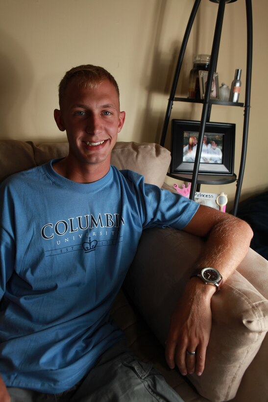 Corporal Kyle Lichtenberger poses for a photograph in his home in Jacksonville, N.C. July 15. He has been accepted by Columbia University in New York.