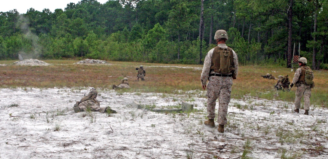 Marines with 1st Battalion, 2nd Marine Regiment, 2nd Marine Division, performed squad attacks and live fire exercises as part of their training for future deployments, aboard Marine Corps Base Camp Lejeune, N.C., July 26, 2011. The Marines were observed and told what they did well and what they made mistakes on after the objective. (U.S. Marine Corps photograph by Pfc. Phillip R. Clark)