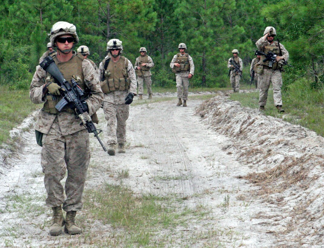 Marines with 1st Battalion, 2nd Marine Regiment, 2nd Marine Division, performed squad attacks and live fire exercises as part of their training for future deployments, aboard Marine Corps Base Camp Lejeune, N.C., July 26, 2011. The squads each went on simulated patrols till they reached their objective points. (U.S. Marine Corps photograph by Pfc. Phillip R. Clark)