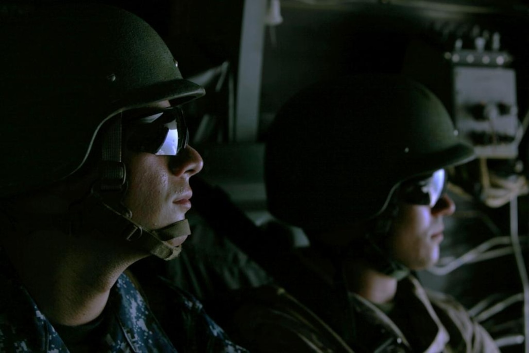 A Navy Reserve Officers’ Training Corps midshipman flies in the back of an MV-22 Osprey during the Career Orientation and Training for Midshipman East 2011 program aboard Marine Corps Air Station New River, July 20. Five hundred ROTC students from across the country will spend four weeks aboard Naval Station Norfolk, Va., Naval Submarine Base Kings Bay, Ga., and Marine Corps Base Camp Lejeune to oversee the various Department of the Navy career options.