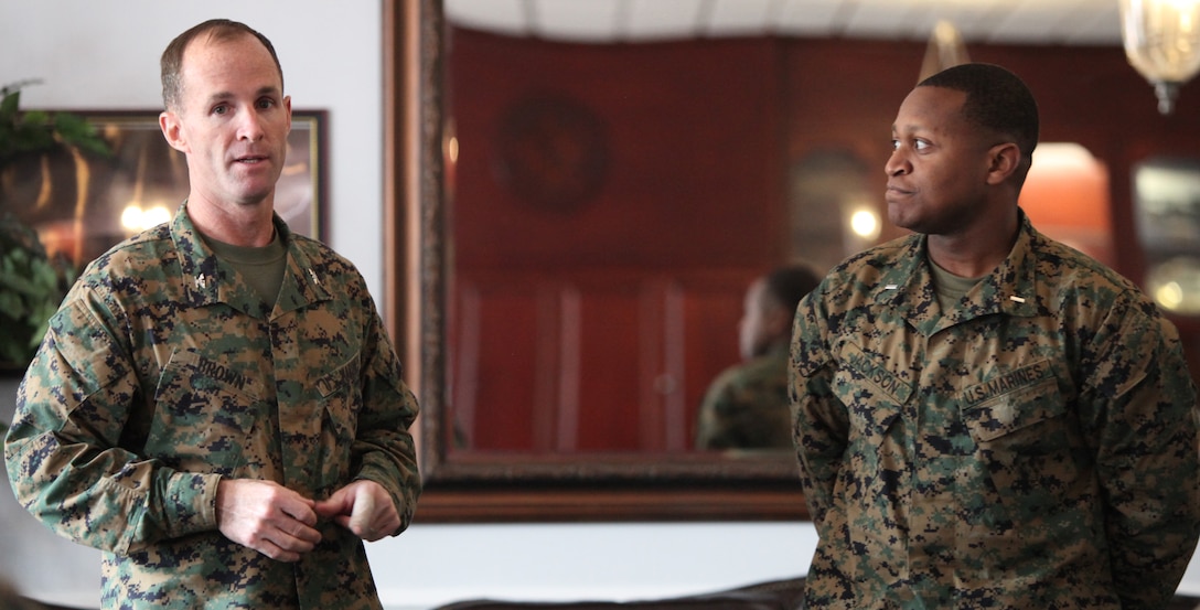 MARINE CORPS BASE CAMP LEJEUNE, N.C. — Col. Michael H. Brown (left), the commanding officer for Headquarters Battalion, 2nd Marine Division, bids farewell to 1st Lt. Jason A. Jackson, executive officer of Headquarters Company, Headquarters Battalion, 2nd Marine Division,(right) at a “Hail and Farewell” ceremony at the Officers’ Club aboard Marine Corps Base Camp Lejeune, N.C., March 9. Three first lieutenants were bid farewell at the ceremony, and right after the Marines gave speeches about how they will miss Headquarters Battalion and the new friends they made while here. (U.S. Marine Corps photograph by LCpl. Phillip R. Clark)