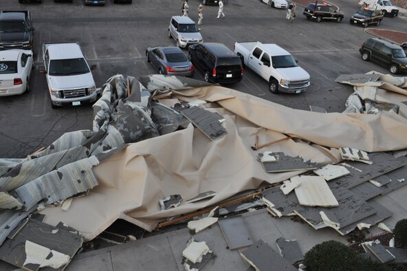 Debris from wind-related roof damage crowds the parking lot at the Nellis Inn, March 6, 2012 at Nellis Air Force Base, Nev. Winds of greater than 30 mph with gusts of up to 63 mph caused power outages, flight delays and property damage throughout the valley surrounding Las Vegas. (U.S. Air Force photo by Airman 1st Class Daniel Hughes)