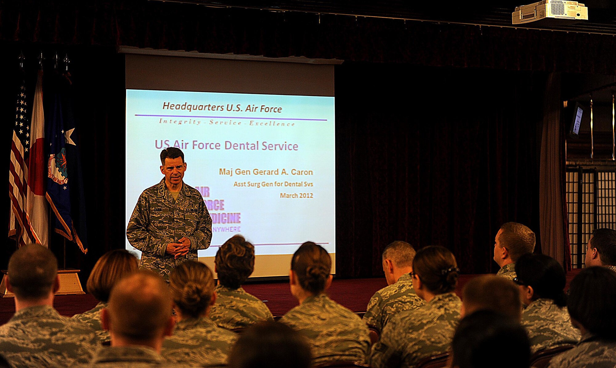 U.S. Air Force Maj. Gen. Gerard Caron, 79th Medical Wing, Andrews Air Force Base, Md., assistant surgeon general for dental services, meets with 18th Medical Group dental Airmen to answer questions about any recent changes involving Air Force dental at Kadena Air Base, March 7, 2012. Caron was visiting dental squadrons throughout the Pacific Air Forces to answer these questions. (U.S. Air Force photo by Airman 1st Class Brooke P. Beers/Released)