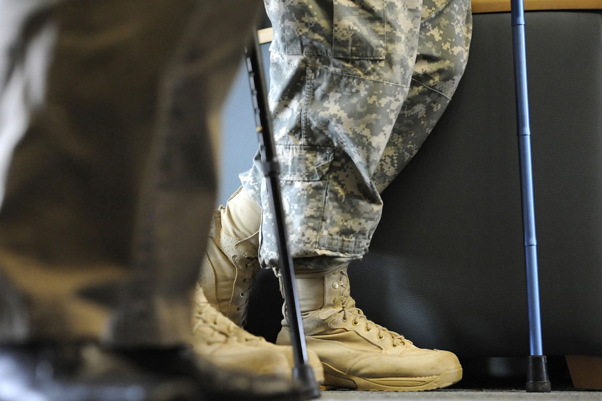 JOINT BASE ELMENDORF-RICHARDSON, Alaska -- Soldiers of the Warrior Transition Battalion watch from the back row in a packed room, leaning on their canes, during the ribbon cutting ceremony celebrating the official opening of the Warrior Transition Battalion-Alaska on Joint Base Elmendorf-Richardson, Friday, March 2, 2012, with guest speaker Maj. Gen. Raymond Palumbo, Commanding General United States Army Alaska and Alaska Gov. Sean Parnell among other distinguished dignitaries.  (U.S. Air Force photo/Justin Connaher)