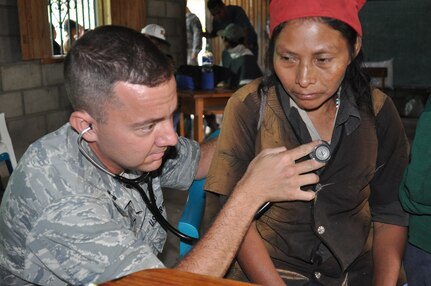 LA CEIBA, Honduras - Capt. Eric Baroni, a Medical Element physician’s assistant, checks a patient’s beating heart during a medical readiness and training exercise here March 7. The team saw more than 300 people on the first day of the four-day MEDRETE. The medical professionals treated illnesses including respiratory infections, skin infections, pneumonia, tuberculosis, diabetes and high blood pressure. (U.S. Air Force photo/Capt. Candice Allen)