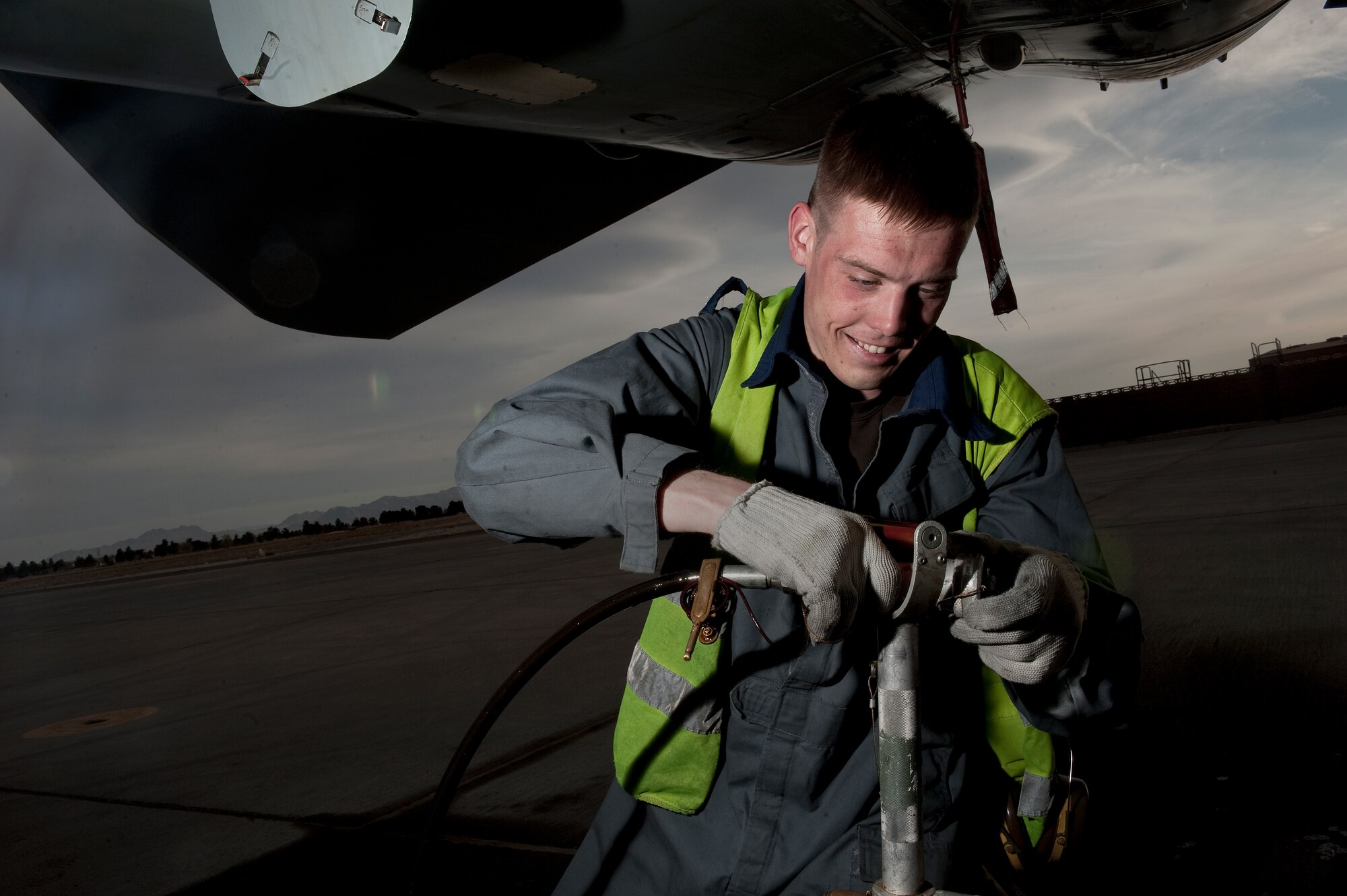 Royal Air Force of the United Kingdom Senior Aircraftsman Steven Collins, 2nd Army Cooperation Squadron, aircraft maintenance mechanic, RAF Marham, replenishes engine oils on a GR4 Tornado, during Red Flag 12-3 March 5, 2012, at Nellis Air Force Base, Nev. Red Flag is a realistic combat training exercise involving the air forces of the United States and its allies.(U.S. Air Force photo by Staff Sgt. Christopher Hubenthal)