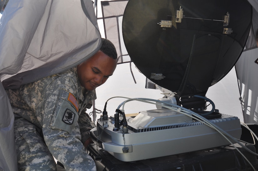 LA CEIBA, Honduras – Army Sgt. John Simon, Army Forces S6 NCOIC, Soto Cano Air Base, Honduras, moves the SWE-DISH, a tactical satellite communication system, during a medical readiness and training exercise here March 7. Simon provided internet and radio capability ensuring members of the MEDRETE team could communicate within the team as well as relay information to Joint Task Force-Bravo. (U.S. Air Force photo/Capt. Candice Allen)