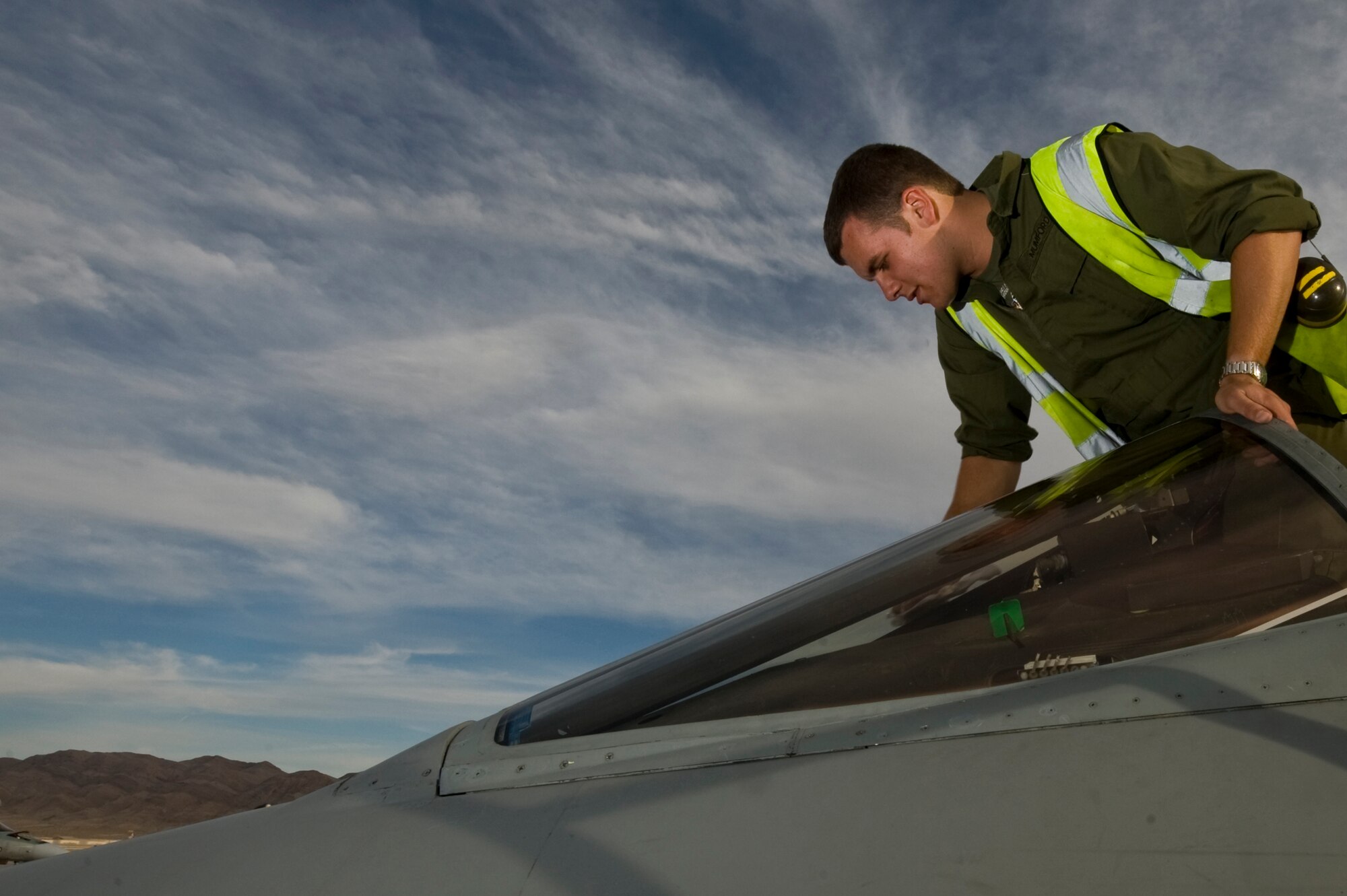 Royal Air Force of the United Kingdom, Senior Aircraftsman Daniel Mumford, 2nd Army Cooperation Squadron, engineer, RAF Marham, finishes closing a panel on a GR4 Tornado, during Red Flag 12-3 March 5, 2012, at Nellis Air Force Base, Nev. Red Flag is a realistic combat training exercise involving the air forces of the United States and its allies.(U.S. Air Force photo by Airman 1st Class Daniel Hughes)