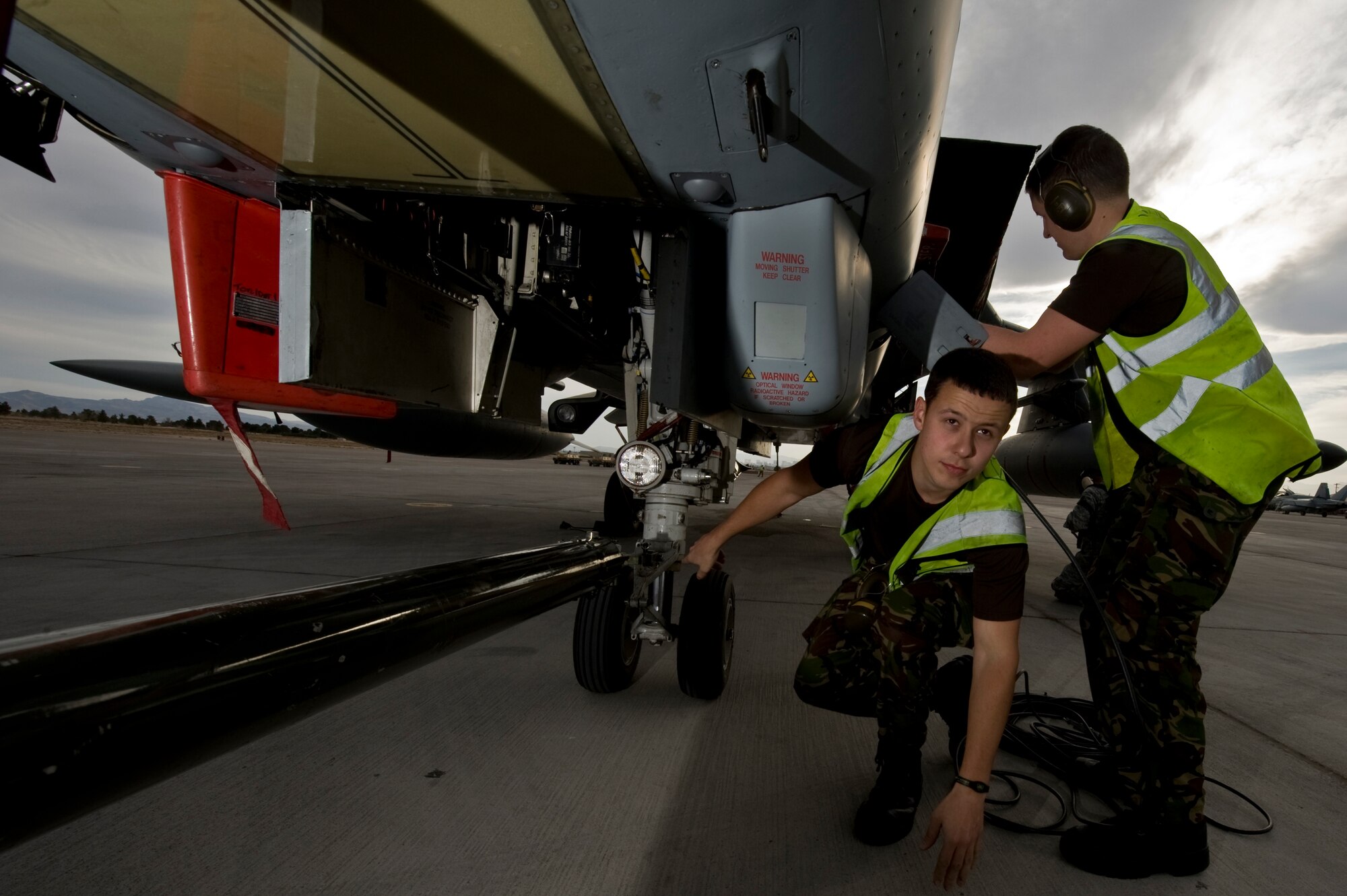 Royal Air Force of the United Kingdom, Senior Aircraftsman Rory Bennett  and Senior Aircraftsman Ryan Williams, both of the 2nd Army Cooperation Squadron, RAF Marham, conduct maintenance on a GR4 Tornado, during Red Flag 12-3 March 5, 2012, at Nellis Air Force Base, Nev. Red Flag is a realistic combat training exercise involving the air forces of the United States and its allies.(U.S. Air Force photo by Airman 1st Class Daniel Hughes)