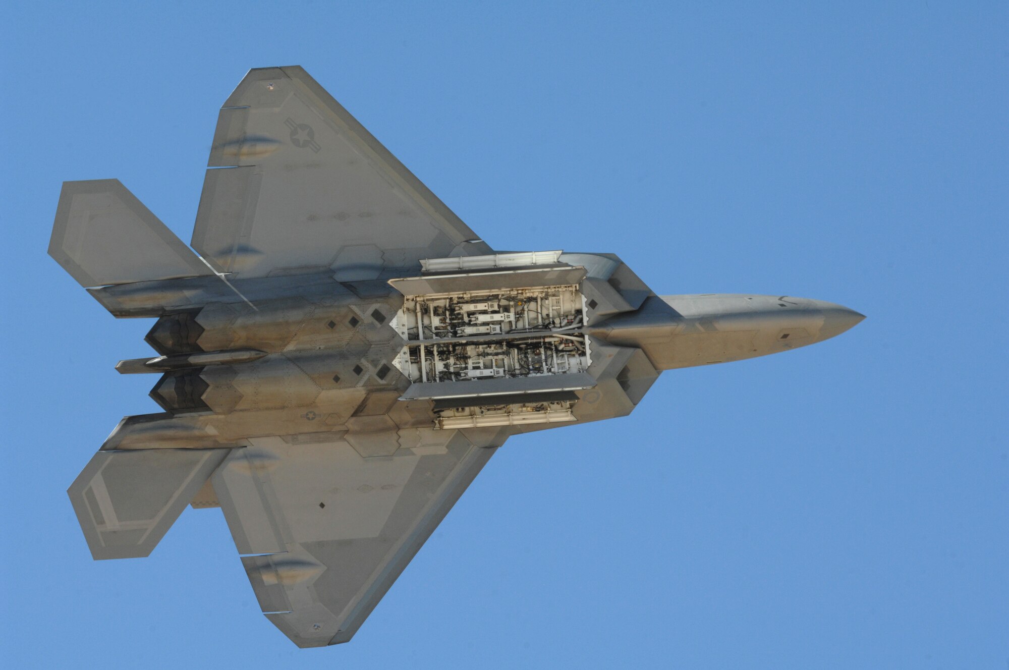 An F-22 Raptor shows off its internal weapons bay at the Heritage Flight Conference on Davis-Monthan Air Force Base, Ariz., March 3. (U.S. Air Force photo by Airman 1st Class Michael Washburn/Released)